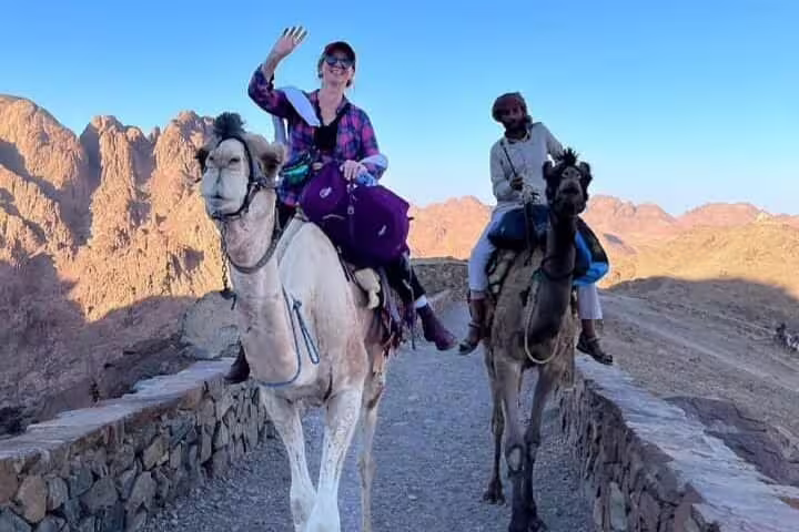 Tourists ride camels on Mount Sinai trail near Sharm El Sheikh, part of St Catherine Monastery day tour