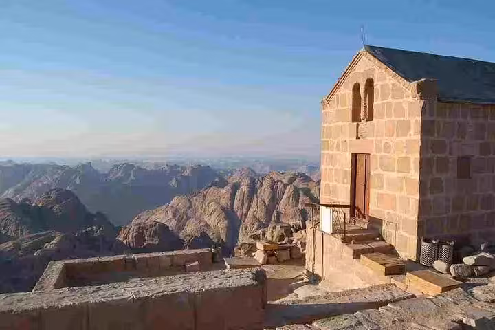 Chapel at Mount Sinai summit on climb tour, overlooking Sinai mountains near St Catherine Monastery, Egypt