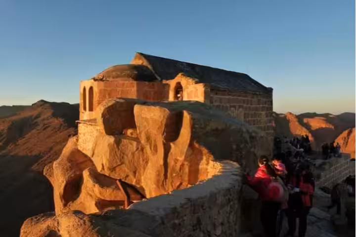 Sunrise chapel on Mount Sinai summit with hikers, private St Catherine night tour from Cairo by bus