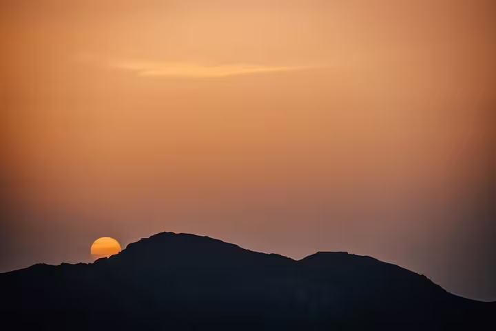 Sunrise over Mount Sinai ridge on Moses Mountain hike, early morning climb to St Catherine Monastery Egypt