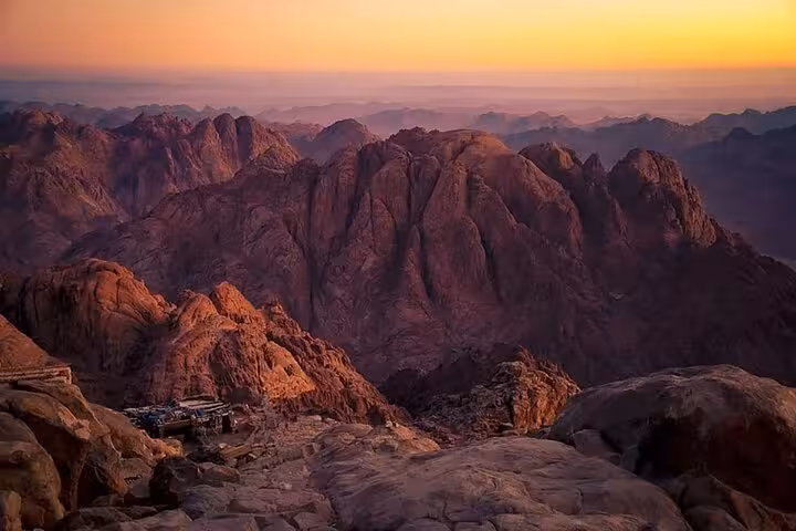 Sunrise view from Mount Sinai near Sharm El Sheikh, rocky peaks glowing on St Catherine tour