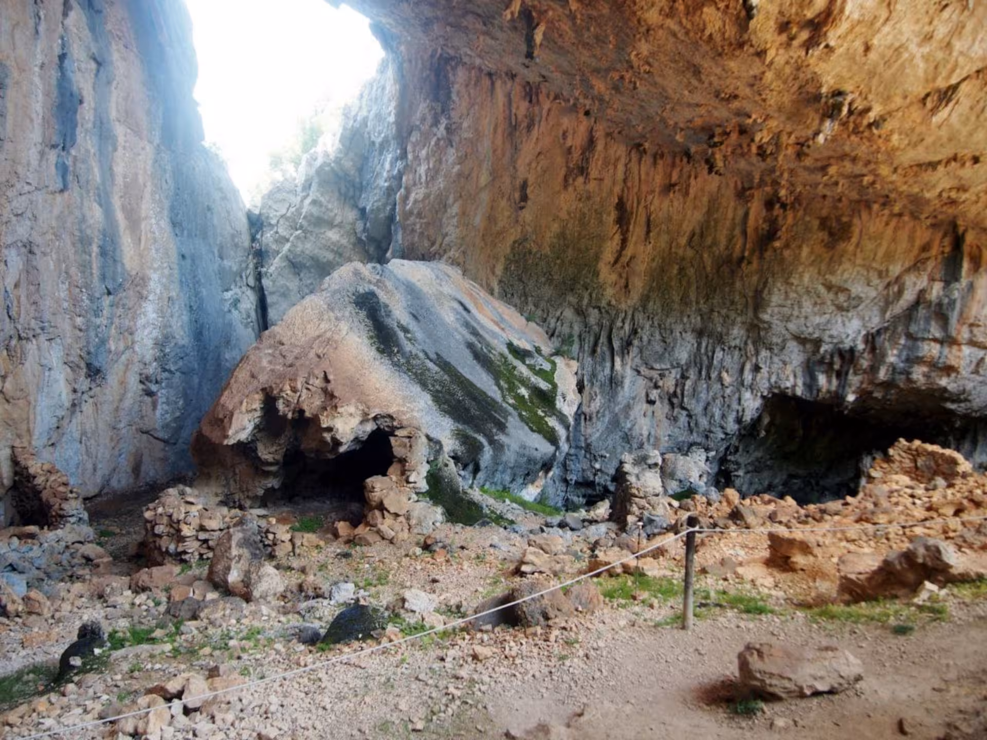 Discover the breathtaking rock formations and archaeological wonders inside Mount Tiscali's hidden cave network.