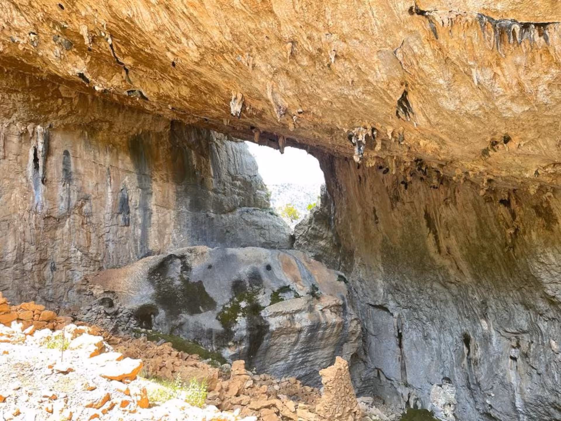 Marvel at the stunning natural arch and dramatic limestone formations on the Mount Tiscali trekking adventure.