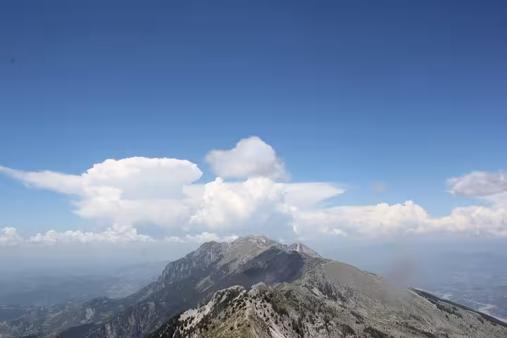 Breathtaking view of Mount Tomorr's rugged peaks and expansive sky, showcasing a prime location for guided hiking tours.