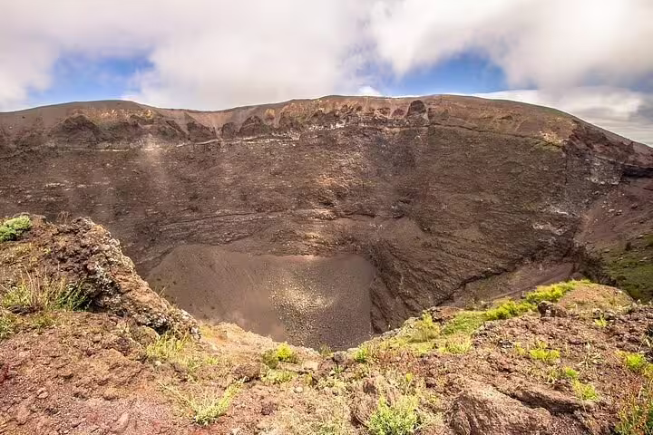 Close-up of Mount Vesuvius summit crater with rugged lava walls seen on Ercolano shore excursion and winery tour