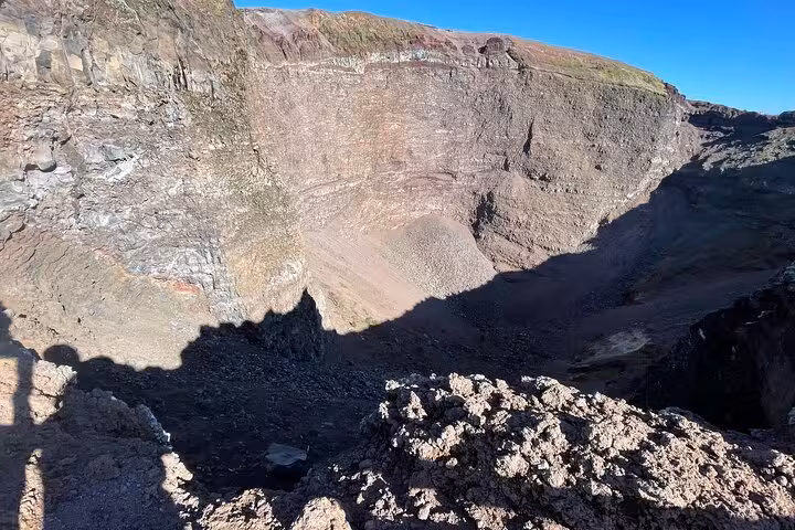 View into the crater of Mount Vesuvius showcasing its rugged terrain, a highlight of the Pompeii and Vesuvius tour.