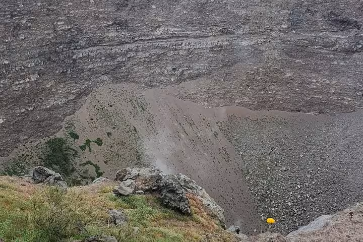 View of Mount Vesuvius crater with rocky terrain, showcasing the natural beauty and geological features of the volcano.