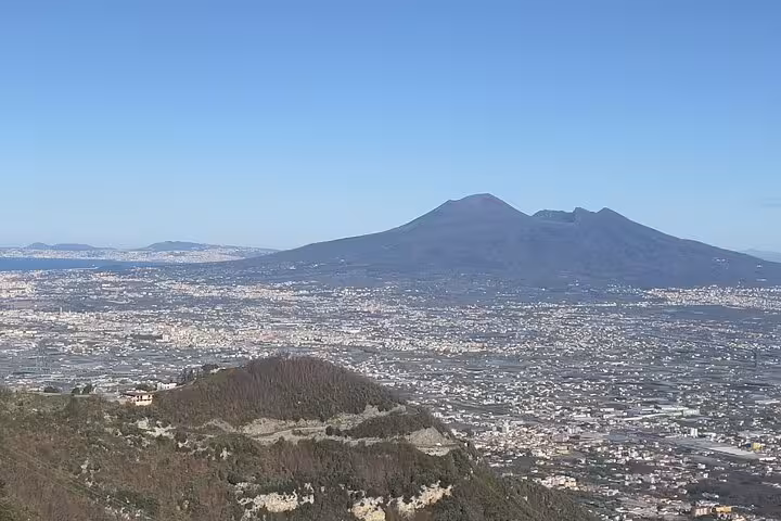 Panoramic view of Mount Vesuvius overlooking the ancient ruins of Pompeii, ideal for Amalfi Coast tours with wine tasting.
