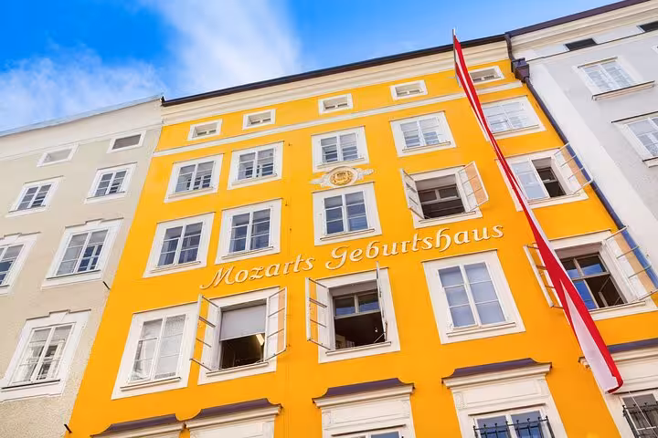 Mozart's Birthplace yellow facade with Mozarts Geburtshaus inscription in Salzburg Old Town