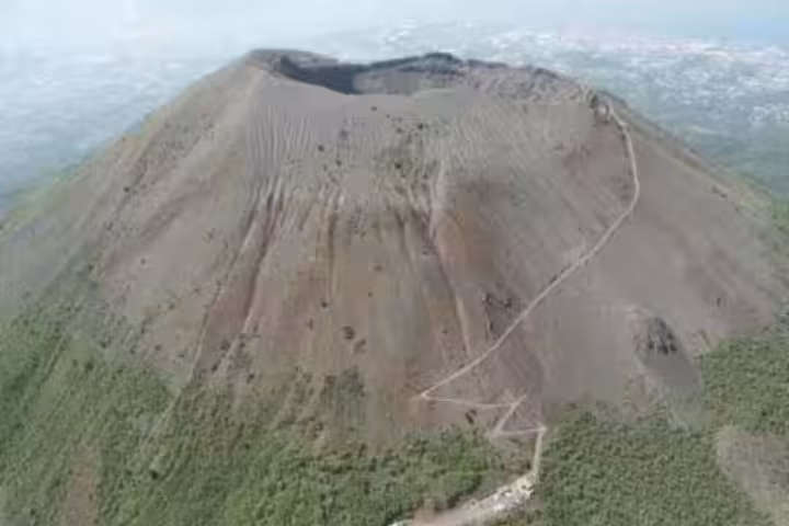 Aerial view of Mt Vesuvius crater and hiking trail above Naples, a top day trip for guided volcano and winery tours