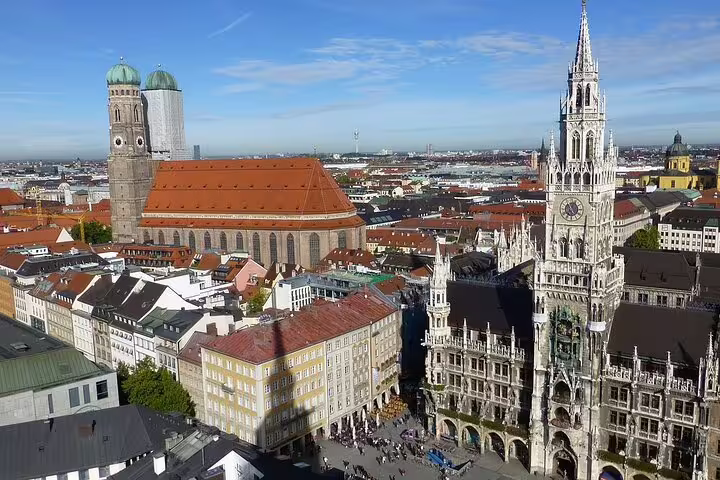 Panoramic view of Munich's Marienplatz with iconic landmarks, a highlight of the Munich and Dachau car tour.