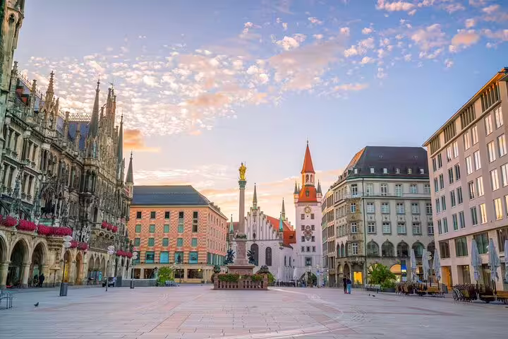 Marienplatz square in Munich with New Town Hall, Marian Column, and Old Town Hall at sunrise