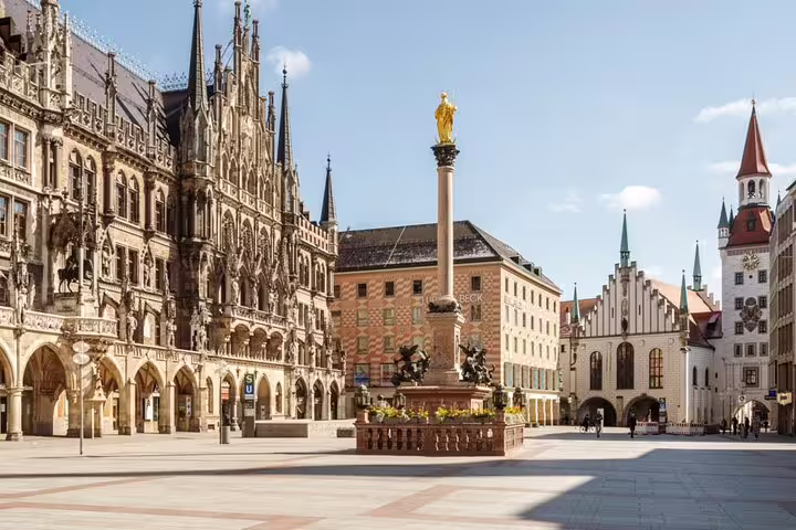 Marienplatz square in Munich with Neues Rathaus facade and Mariensäule golden column