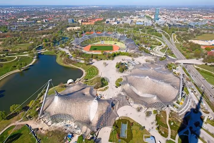 Aerial view of Munich Olympic Park and stadium, modern landmark seen on Vienna to Munich private transfer route