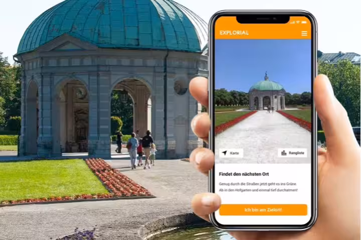 Self-guided Munich scavenger hunt tour app shown at Hofgarten pavilion, interactive sightseeing challenge