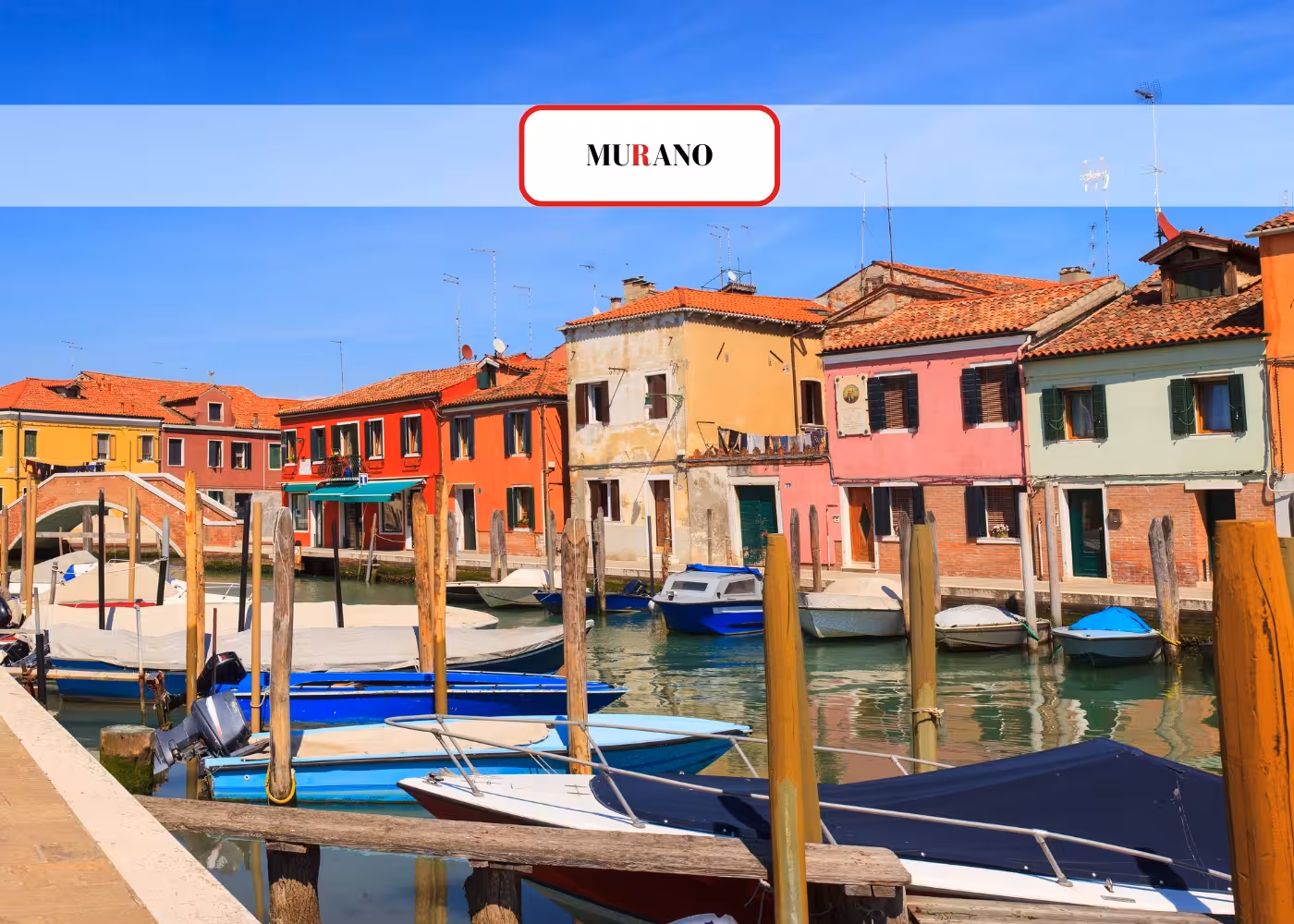 Colorful houses and boats along the canal in Murano, a key stop on the Venice Islands Guided Cruise.