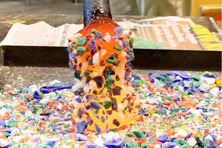 Molten glass with colorful fragments at a Murano glassblowing workshop stop on a private boat tour Murano & Burano