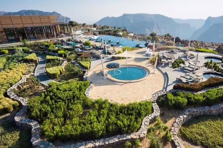 Luxurious resort with pools and lush gardens overlooking the spectacular Jabal Al Akhdar mountain scenery.