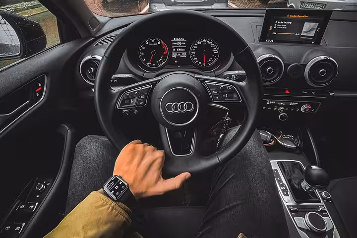 Guest enjoying comfortable private Audi car interior on Muscat city tour with professional driver and door-to-door transport