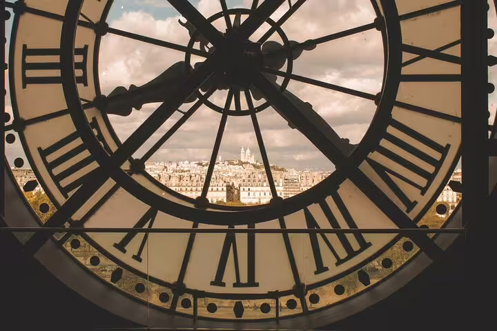 View of Montmartre and Sacré-Cœur through the giant clock face at Musée d'Orsay, Paris