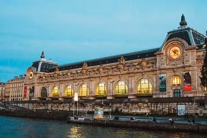 Musée d’Orsay at dusk on the Seine, ideal Paris add-on to a Louvre Museum Experience group or private tour
