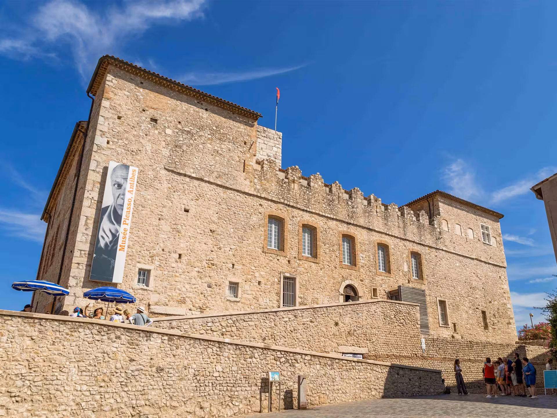 Musée Picasso castle in Antibes, a historic stone fortress on the French Riviera under blue skies