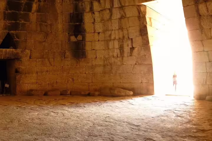 Sunlit entrance of the Mycenae beehive tomb interior on the Epidaurus, Mycenae and Nafplio small-group tour