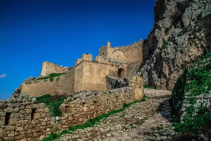Ancient Mycenae citadel stone path and fortress walls on private half-day trip from Athens, Greece