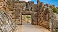 Walking through the Cyclopean stone entrance at Mycenae, key highlight on private Nafplio and Epidaurus tour