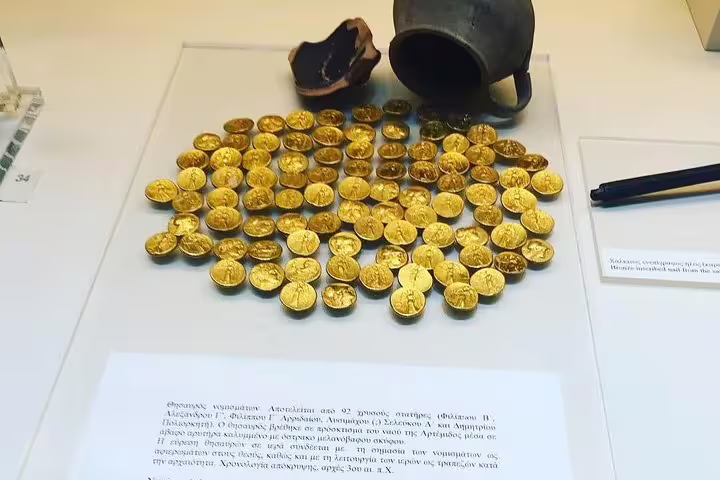Gold coin hoard display at Mycenae museum on Epidaurus, Mycenae and Nafplio small-group tour from Athens