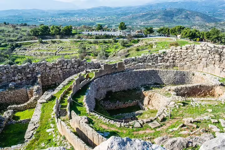 Circular grave circle ruins at Ancient Mycenae, key stop on a private full-day tour from Athens to Nafplio