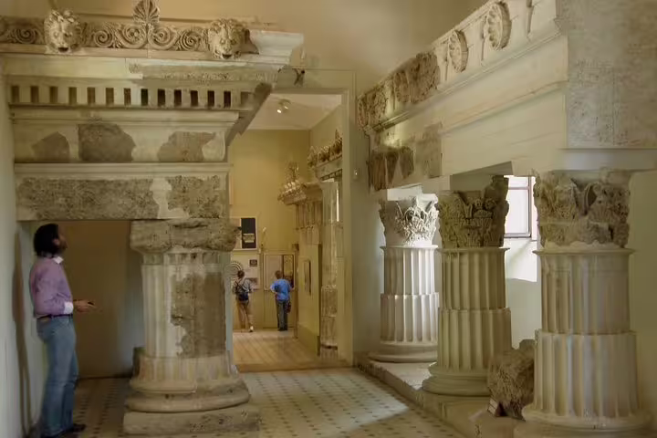 Ancient stone columns and friezes inside Mycenae museum on Epidaurus, Mycenae and Nafplio small-group tour