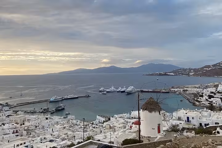 Mykonos harbor panorama with yachts and whitewashed town, scenic stop on half-day private island tour