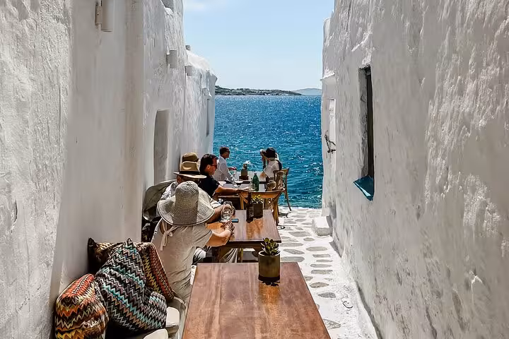 Seaside café in Mykonos Little Venice with whitewashed alley, Aegean views on island sights tour