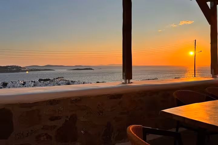 Mykonos sunset sea view from a terrace, perfect backdrop after an authentic Greek cooking class experience