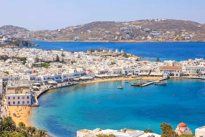 Panoramic Mykonos Town and turquoise bay view, ideal for 5 Senses Experience Journey cruise travelers