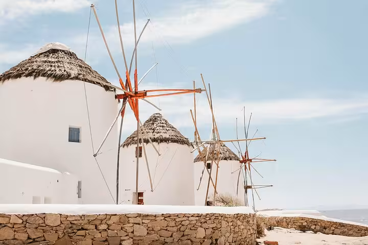 Mykonos windmills in Chora on a private Mykonos Town and countryside tour, iconic whitewashed landmark view