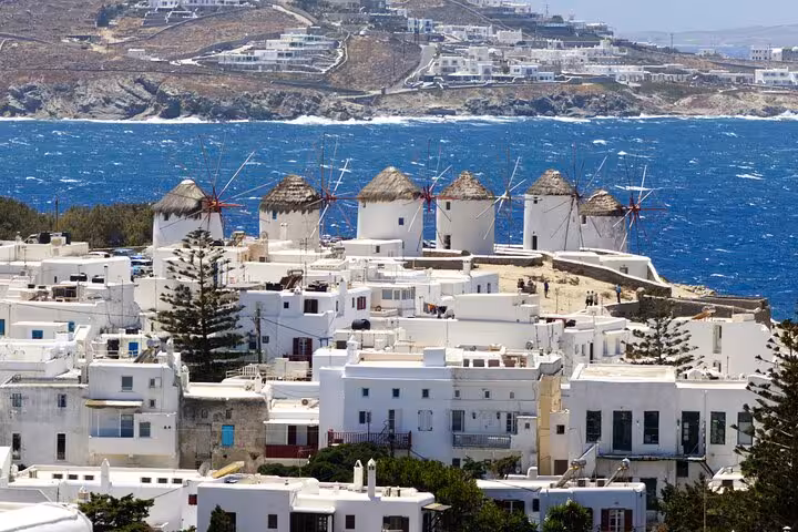Mykonos Chora windmills above whitewashed Little Venice homes, a must-see stop on a private Mykonos tour