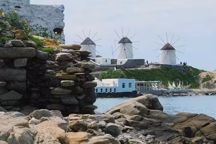 Mykonos iconic windmills above the sea, scenic stop on a private Mykonos tour experience at your pace