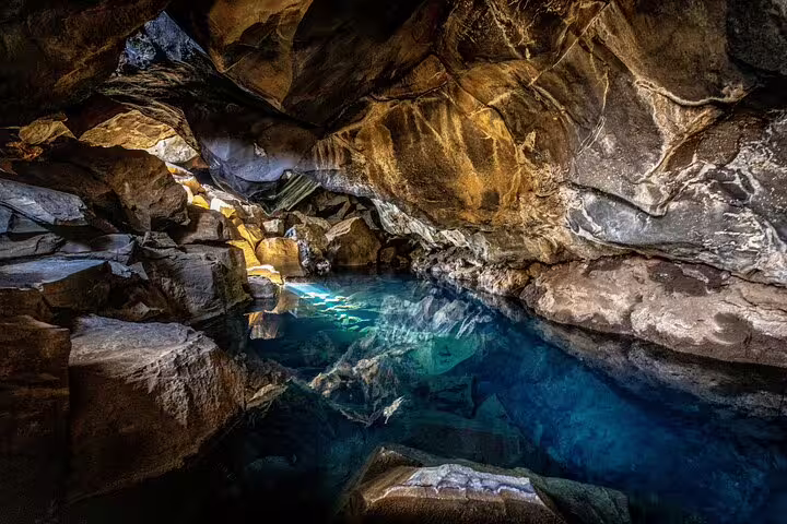 Crystal clear geothermal pool inside a lava cave at Lake Myvatn, Iceland