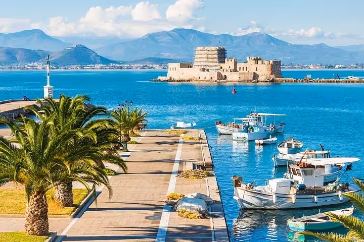 Nafplio waterfront with boats and Bourtzi Castle, scenic stop on Epidaurus theater and Corinth Canal luxury tour