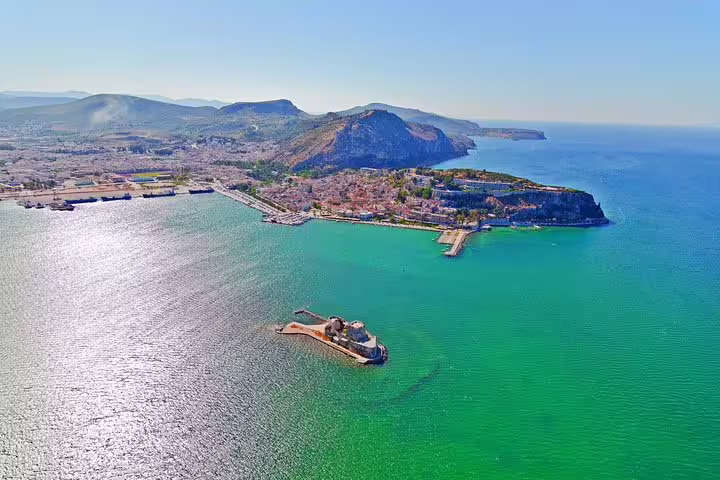 Aerial view of Nafplio coastline and Bourtzi fortress, scenic stop on private day tour from Athens