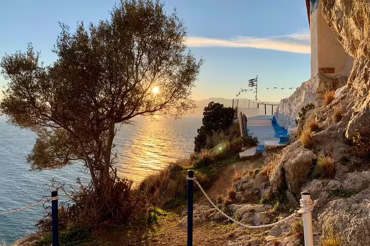 Sunset sea view path by rocky coast near Nafplio, scenic stop on Corinth Canal day trip and wine tasting experience