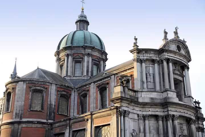 Baroque dome and ornate stone facade of Saint-Aubain Cathedral in Namur, Belgium