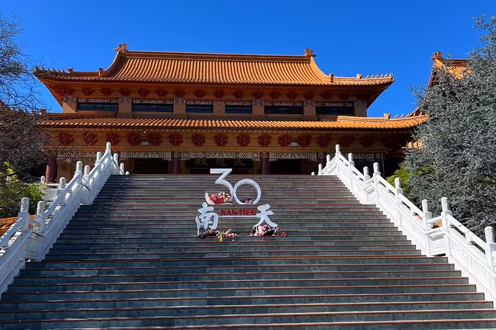 Majestic steps leading to a traditional temple at Nan Tien, a key attraction on the Jervis Bay Private Tour.