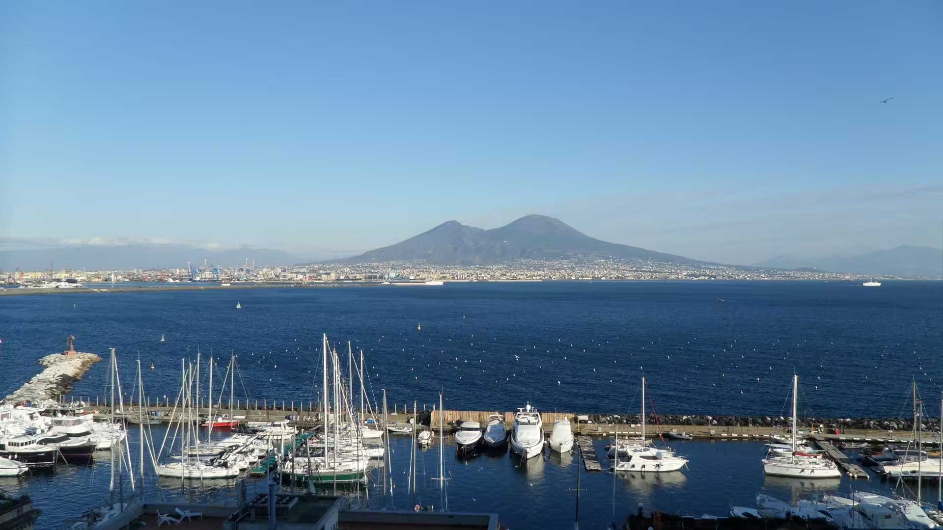 Panoramic view of Naples harbor and Mount Vesuvius over the Tyrrhenian Sea on a Mediterranean Passion road trip