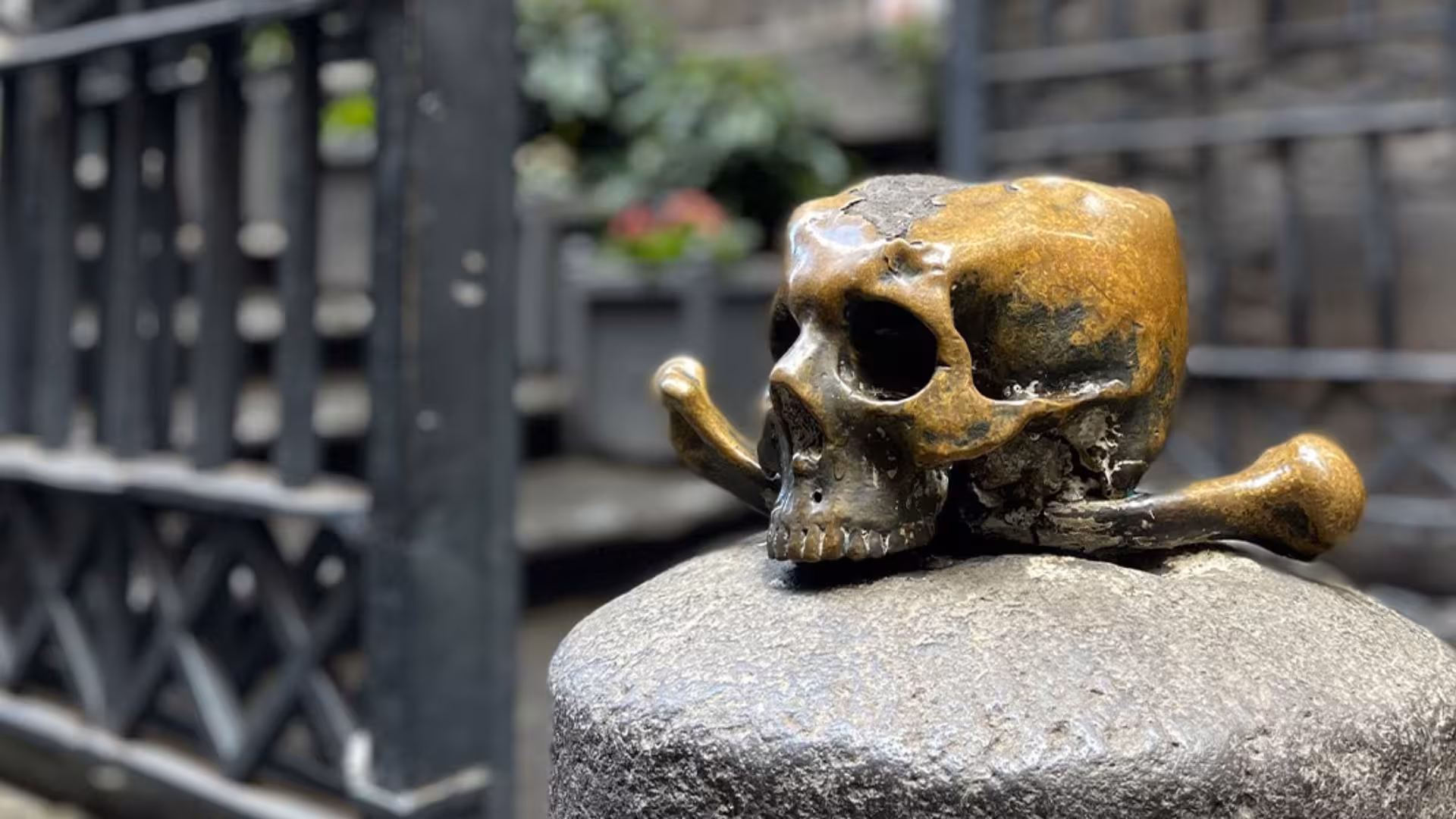 Bronze skull sculpture at Naples' Chapel of the Pezzentelle Souls, a highlight of Italian folklore tours.