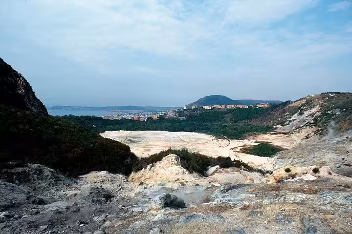 Panoramic view of steaming volcanic crater and Bay of Naples from Phlegraean Fields on a private day trip from Naples to Pozzuoli