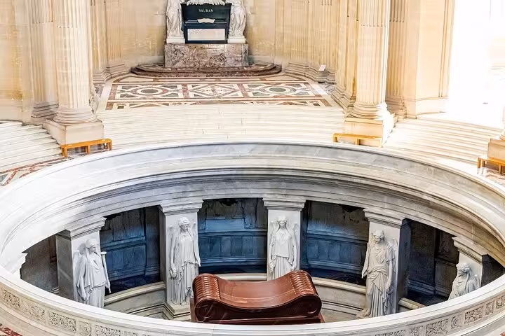 Napoleon’s Tomb at Les Invalides in Paris, circular crypt view with red sarcophagus on guided tour