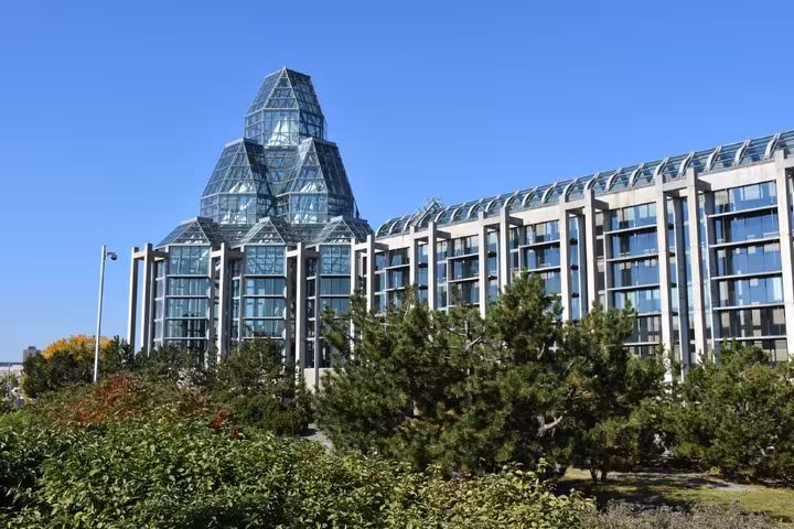 National Gallery of Canada glass pyramid architecture surrounded by trees in Ottawa